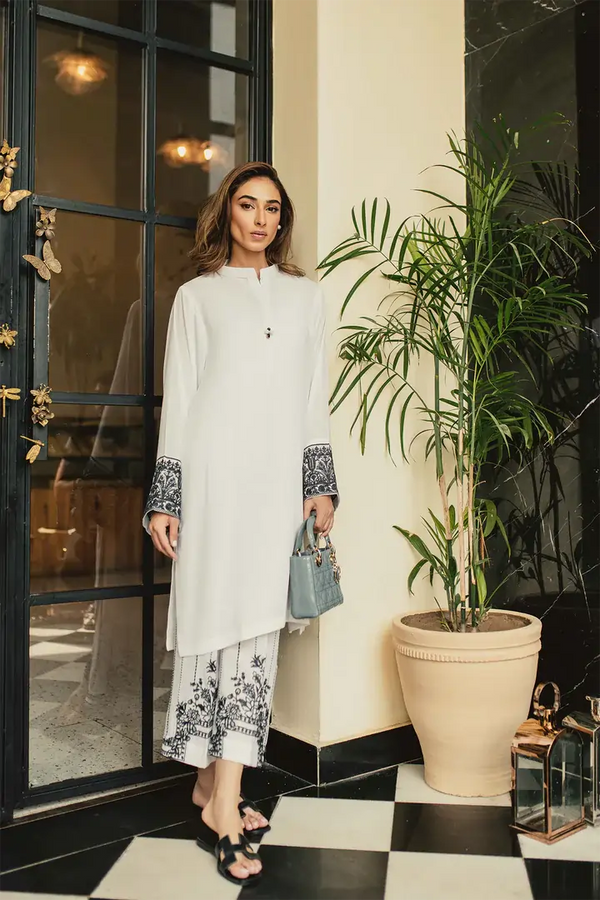 A crisp white solid co ord set from our co ord sets women collection, featuring embroidered trousers and a matching inner perfect for festive dresses for women.